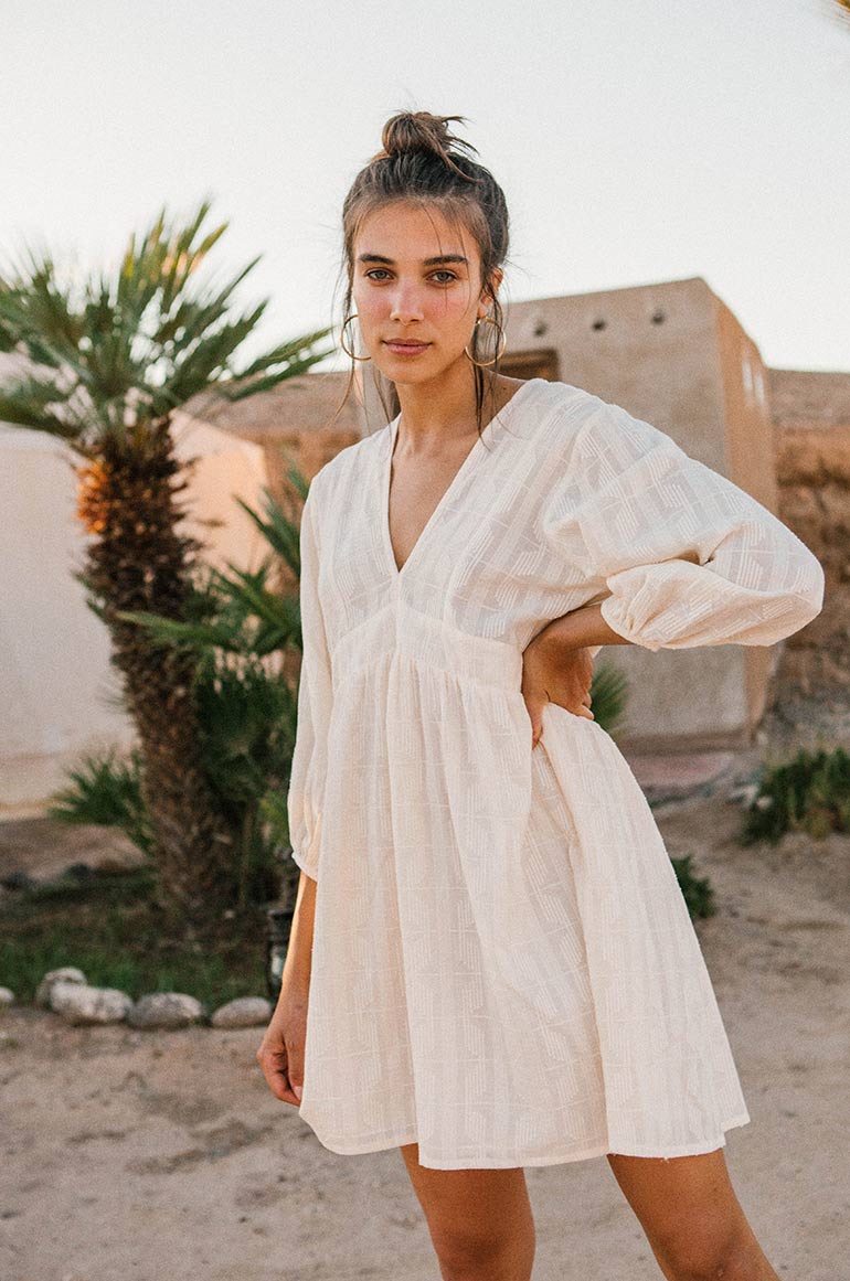 Sustainable white mini dress with gathered waist